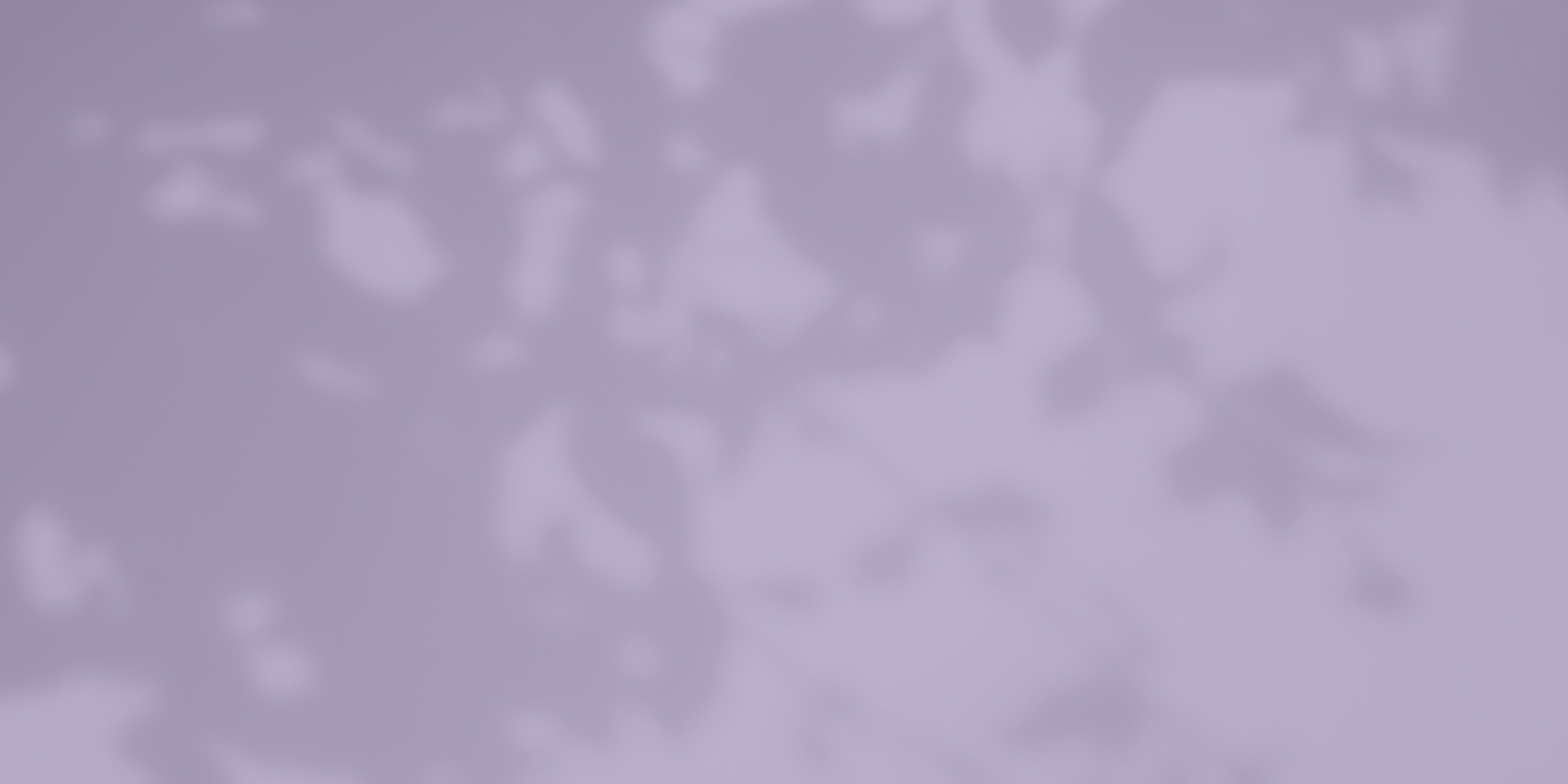 Blurry, abstract pattern with light and dark shades of purple, possibly resembling shadows or shapes on a surface—subtle hints of gold evoke the allure of precious gemstone details.